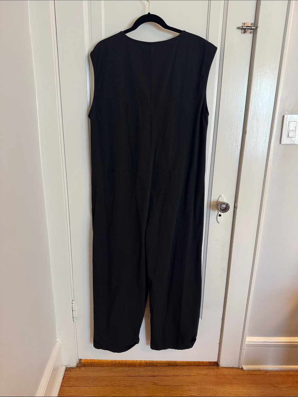 Sleeveless Black Jumpsuit with Front Buttons and utility pockets - Picture 3 of 12